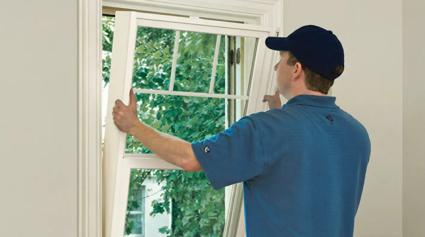 Professional contractors performing a residential window insulation and replacement service in Santa Ana, CA